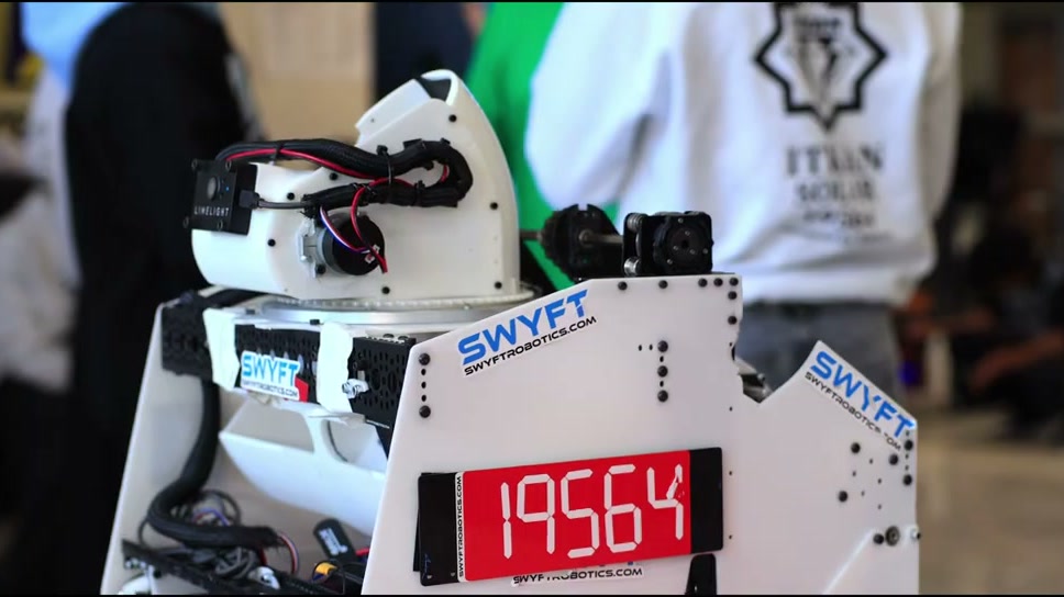 Close-up of the 19564 robot, its number on a red display panel below a white turret carrying a Limelight camera.